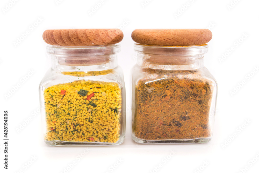 spices in jars on a white spices in jars on a white