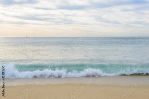 Set of six pictures of a fantastic ocean wave in different stages. Cloudy sunrise sky. San Jose del Cabo. Mexico. © karamysh