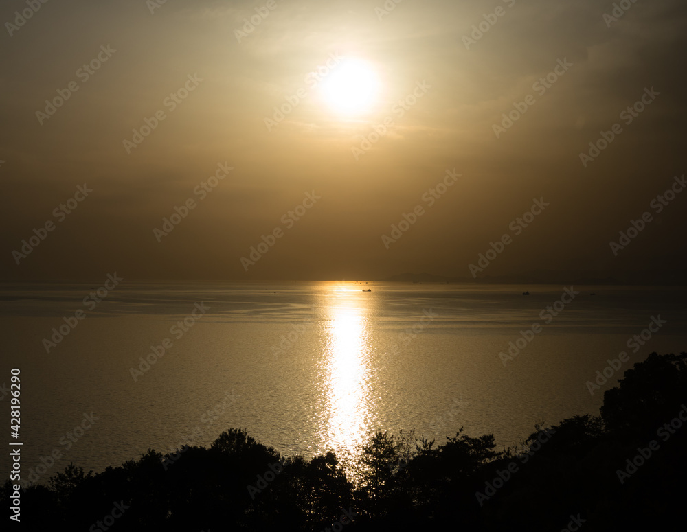 Sun setting over the Seto Inland sea, view from Kyukamura Setouchi Toyo - Ehime prefecture, Japan