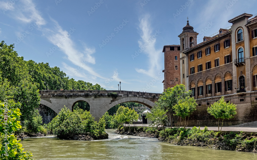 Rome Italy, Tiber river with bridge Fabricio to Tibertina island and Caetani fortress tower picturesque view