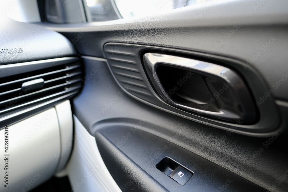 Interior door handle detail of a modern car