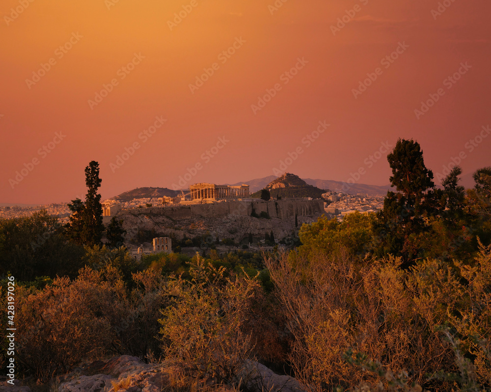Acropolis of Athens, Greece under fiery sky, scenic view