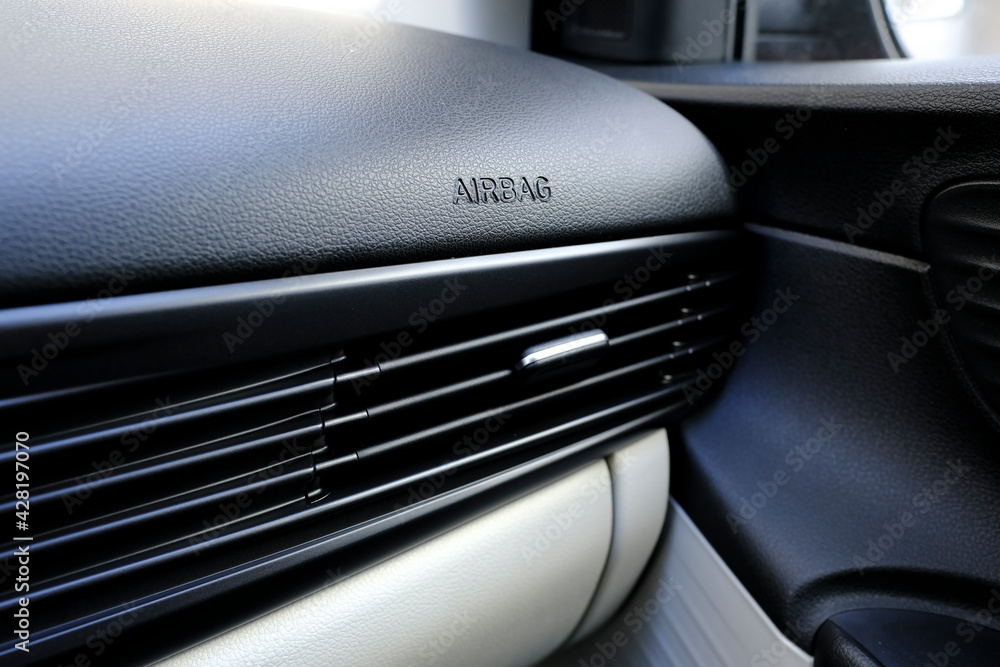 Air duct and ventilation details on dashboard of a car with airbag text
