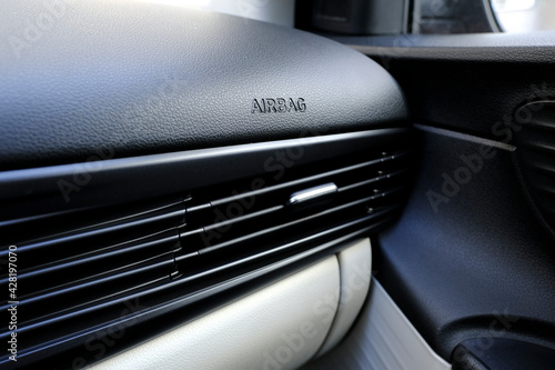 Air duct and ventilation details on dashboard of a car with airbag text