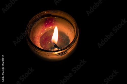 burning candle with black background