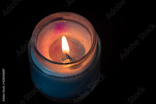 burning candle in the dark