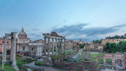 Ruins of Forum Romanum on Capitolium hill day to night transition timelapse in Rome, Italy. Top aerial view with cloudy cky photo