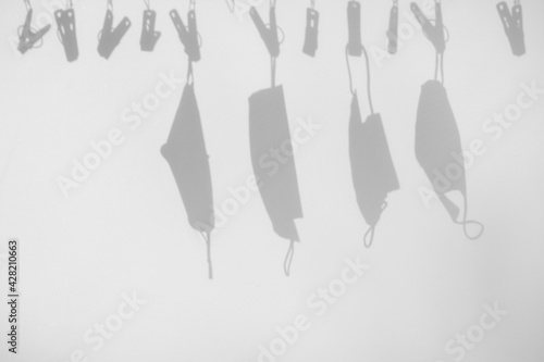 health care concept, abstract blur of shadows leaf overlay on white fabric texture background, protect virus COVID-19