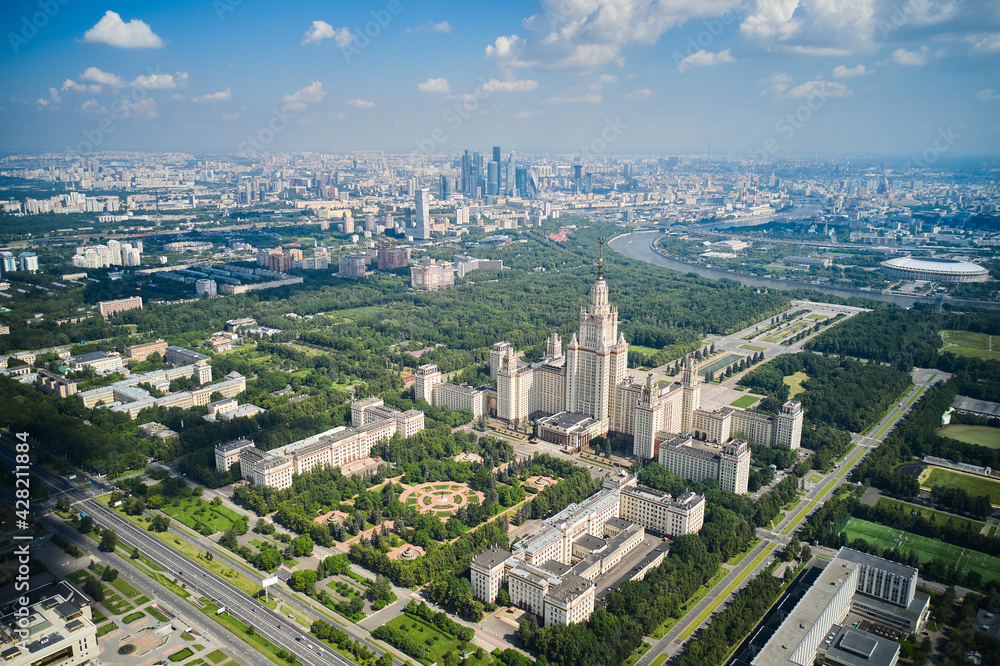 Moscow State University and Moscow Business Center on background. Botanic Garden and Moskva river. Panoramic view of capital of Russia