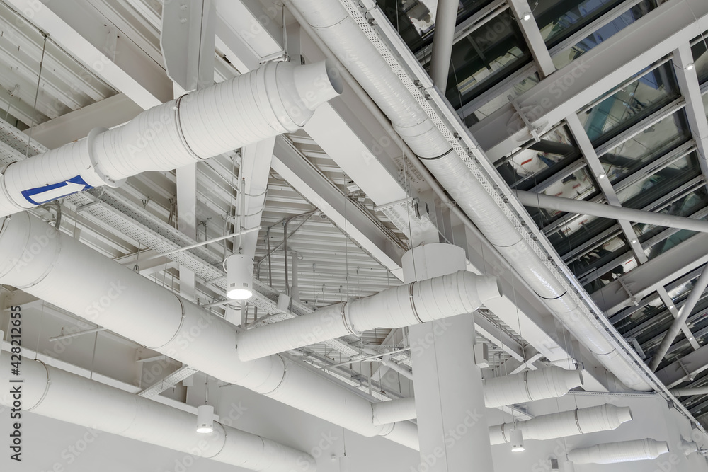 ventilation system under ceiling of modern warehouse or shopping center ...