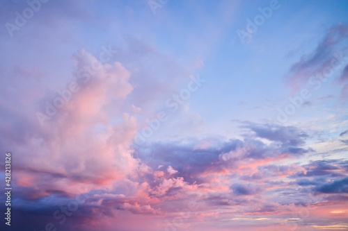 The rose of sunset. Beautiful pink clouds on the blue sunset sky