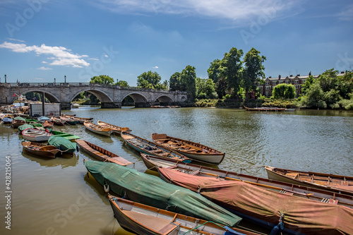 Inside out view of Rowing boats for rent under Richmond bridge at the river Thames, London, United Kingdom.