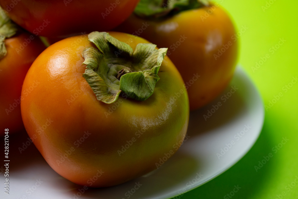 persimmon fruit on a plate persimmon fruit on a plate