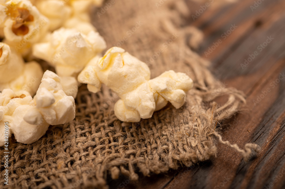 Popcorn scattered on the table. Self-isolation in the covid-19 pandemic. Popcorn scattered on the table. Self-isolation in the covid-19 pandemic.