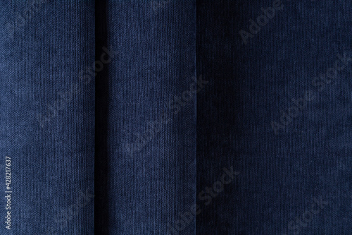 curtain fabric canvas dark blue, draped with folds, background