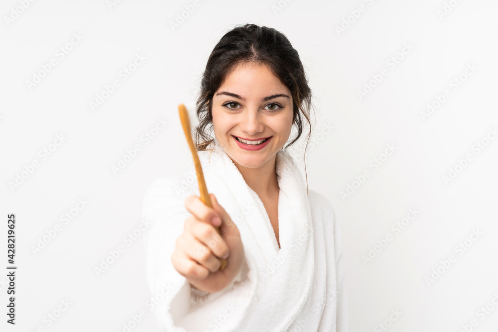 Young caucasian woman isolated on white background with a toothbrush Young caucasian woman isolated on white background with a toothbrush