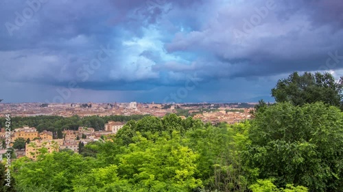 Panoramic aerial view of historic center timelapse of Rome, Italy. Cityscape with heavy dramatic clouds and rain photo