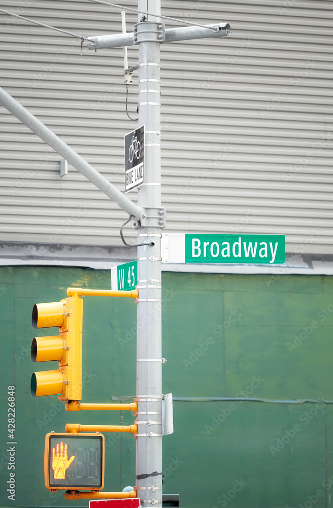 Naklejka premium Broadway road sign in New York City, selective focus, USA.