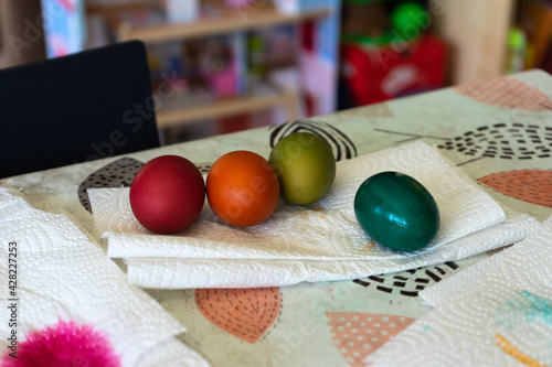 Little girl dyes easter eggs with her mother.