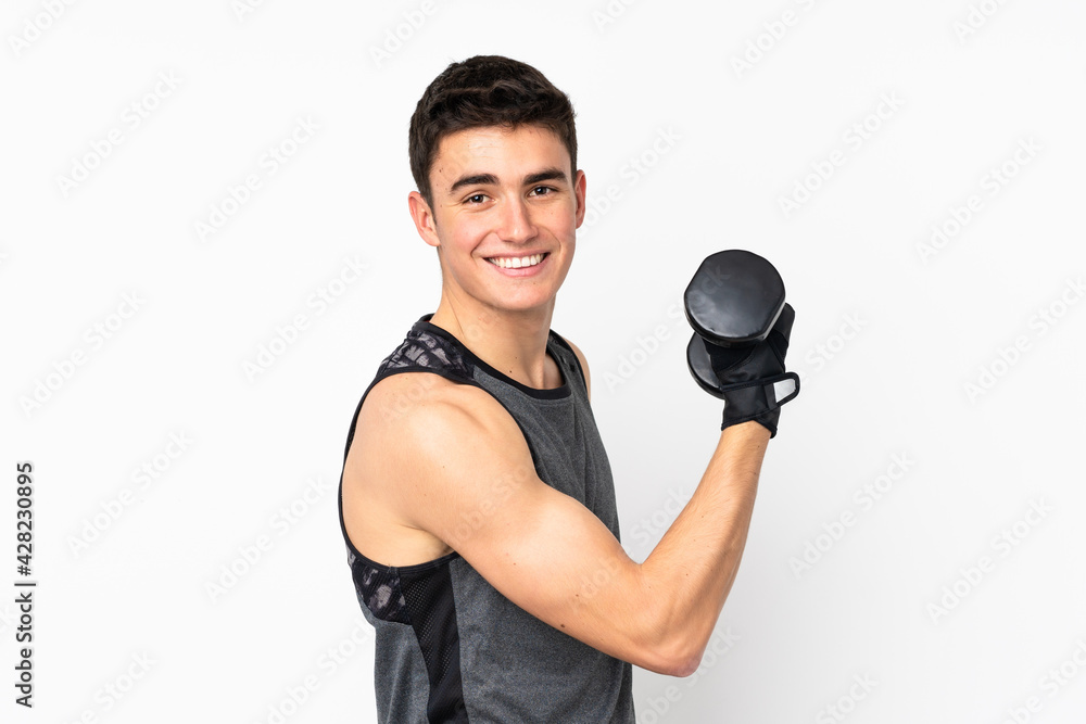 Teenager sport man over isolated white wall making weightlifting