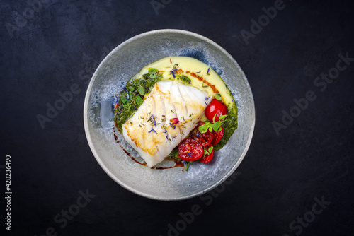Foto Modern style traditional fried skrei cod fish filet with mashed potato cream and