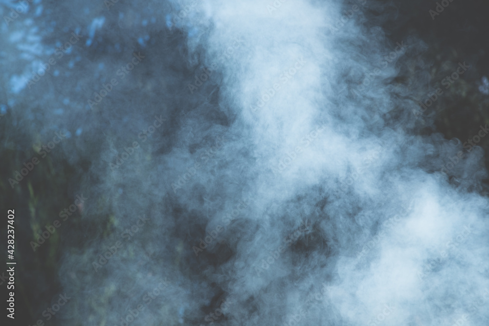 Holidays outdoors. Strong smoke from the grill as background. Holidays outdoors. Strong smoke from the grill as background.