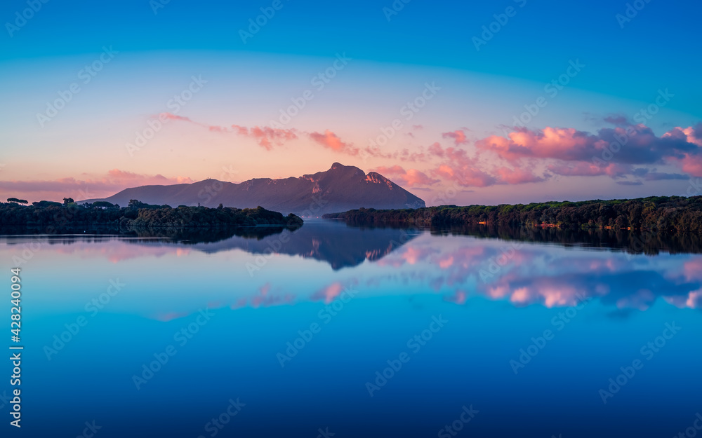 Fototapeta premium Sunrise over Mount (Promontorio del) Circeo, Latina, Lazio, Italy Monte Circeo or Cape Circeo is a mountain remaining as a promontory that marks the southwestern limit of the former Pontine Marshes.