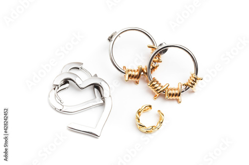 silver heart shaped earrings isolate on white .