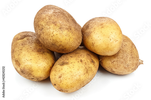 Pile of unwashed ripe potatoes isolated on white background