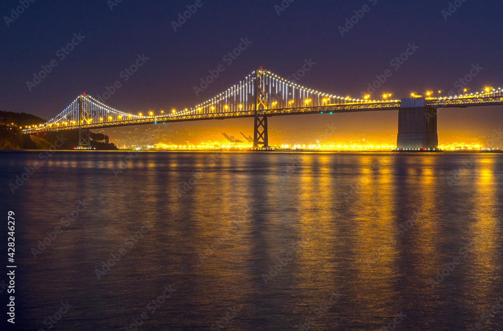 The double deck San Francisco–Oakland Bay Bridge, or Bay Bridge, 1936, is part of Interstate 80 and the direct road between San Francisco and Oakland California.