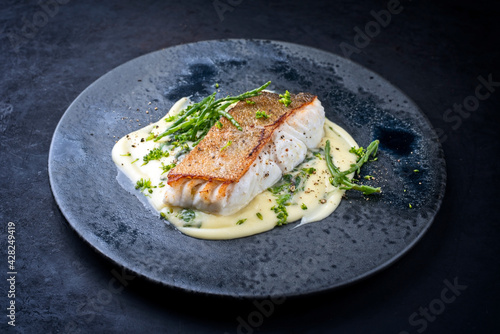 Tableau sur toile Modern style traditional fried skrei cod fish filet with mashed potatoes and gla