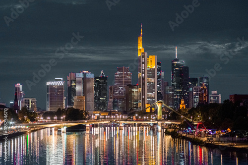 FRANKFURT  GERMANY  25 JULY 2020 Modern cityscape of the business district with reflection on the Main river at night