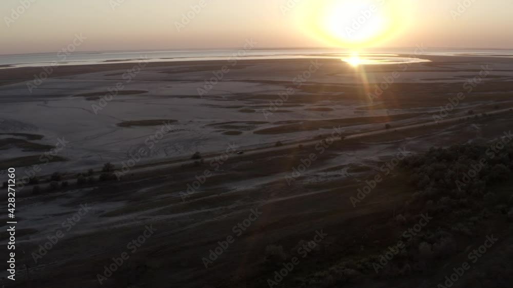 aerial view. view from flying drone on green water with waves in Azov sea, Ukraine. Climate changing, pollution water and environment. pink salt lake