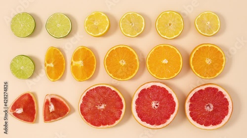 Wallpaper Mural Creative layout made of fresh organic sliced citrus fruits on sandy background. Stop motion flat lay Torontodigital.ca