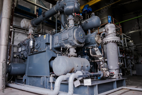 Four stage diaphragm piston compressor. Air separation unit. Сryogenic industrial plant. Liquid oxygen factory. Tube and vessel © Николай Амосеев