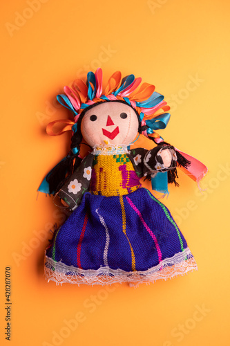 mexican toy  on powerfull color background