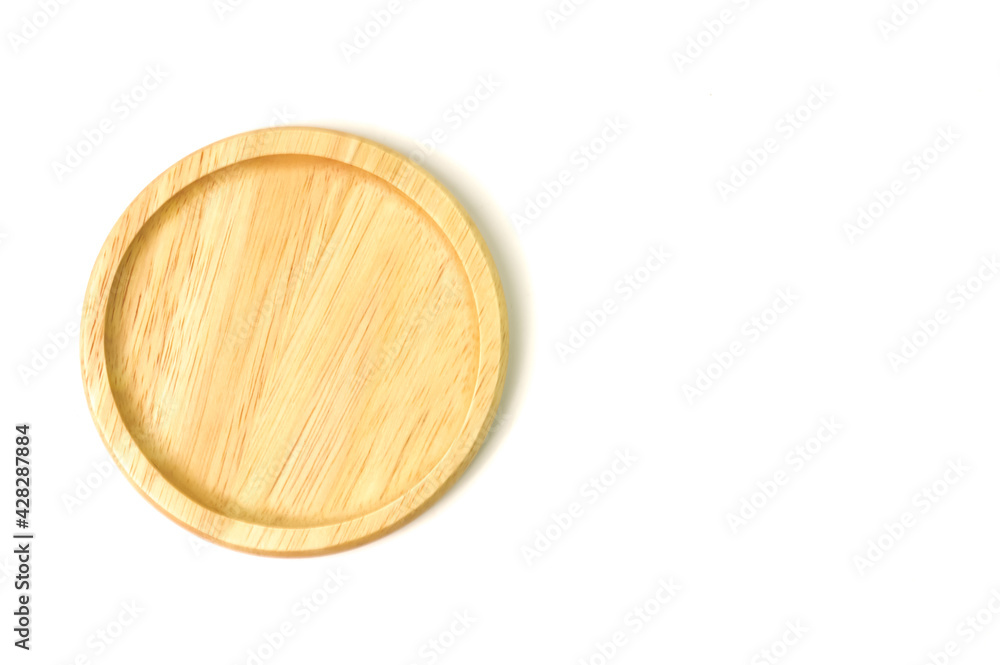 Top view of round wooden plate isolated on a white background Top view of round wooden plate isolated on a white background