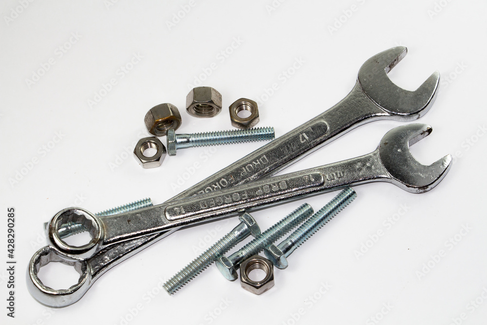 Tools and bolts isolated against a white background Tools and bolts isolated against a white background