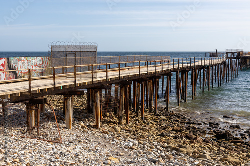 closed off security at the start of the old Rapid Bay jetty ruins on the Fleurieu Peninsula South Australia on April 12th 2021