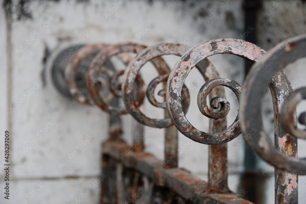 Old, oxidized, curled iron fence pieces in Rome Italy. Old, oxidized, curled iron fence pieces in Rome Italy.