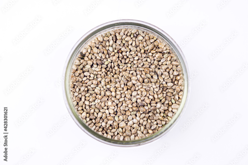 Cannabis seeds in glass bowl isolated on white Cannabis seeds in glass bowl isolated on white