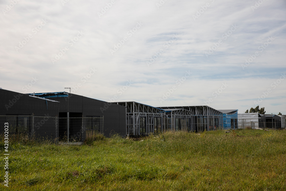 Modern residential housing construction on greenfield site.