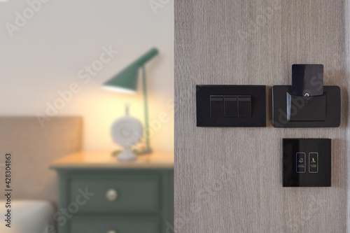 Hotel room or apartment door and lights electronic card in the wall photo