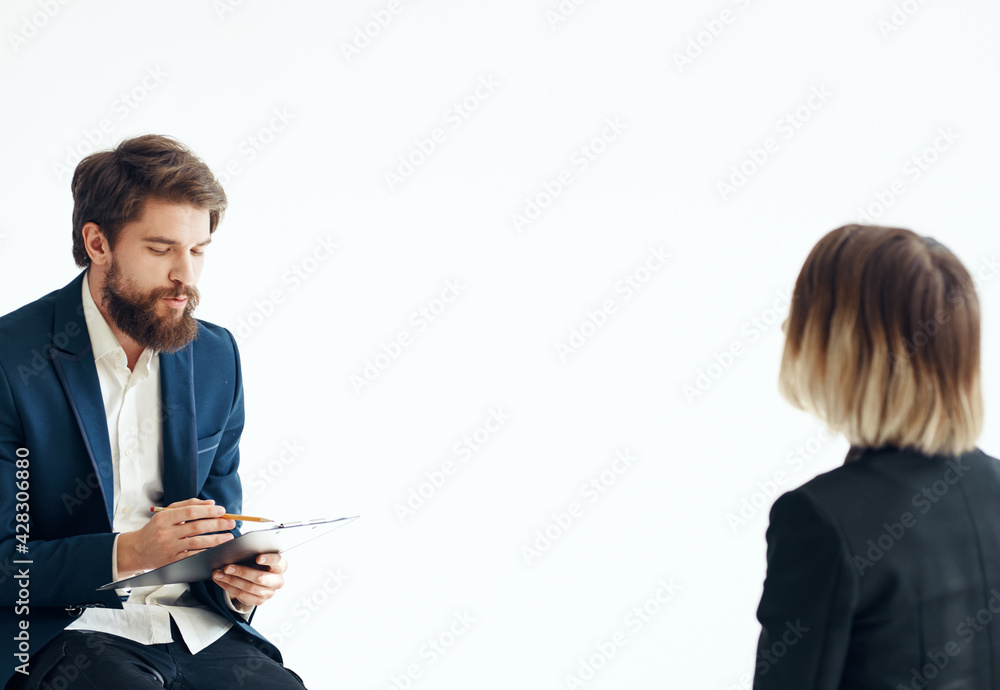 A man in a classic suit is talking to a female psychologist communication work office A man in a classic suit is talking to a female psychologist communication work office