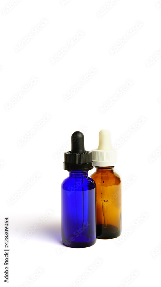 Brown glass bottles.A bottle with a pipette, isolated on a white background. glass container for cosmetic skin care products. Aromatherapy, essence, or perfume is empty. a bottle of cosmetic dropper. Brown glass bottles.A bottle with a pipette, isolated on a white background. glass container for cosmetic skin care products. Aromatherapy, essence, or perfume is empty. a bottle of cosmetic dropper.