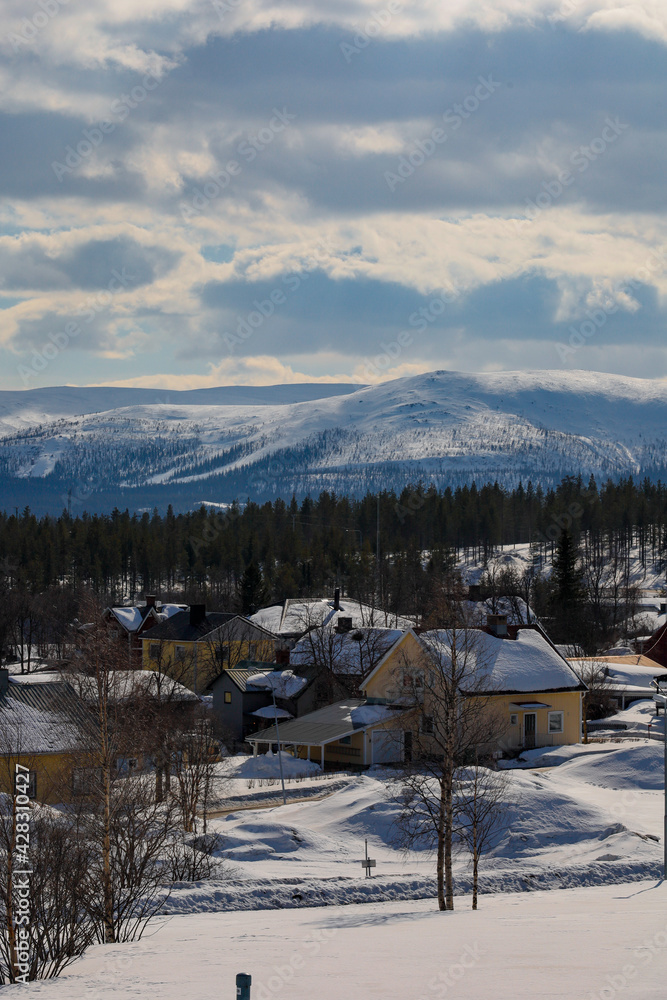 Gallivare, Sweden A view of residential houses and snow-capped mountains