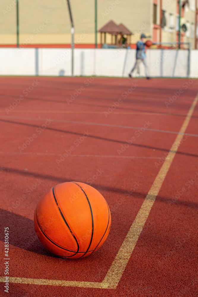 Basketball ball in the outdoor public court. Basketball ball in the outdoor public court.
