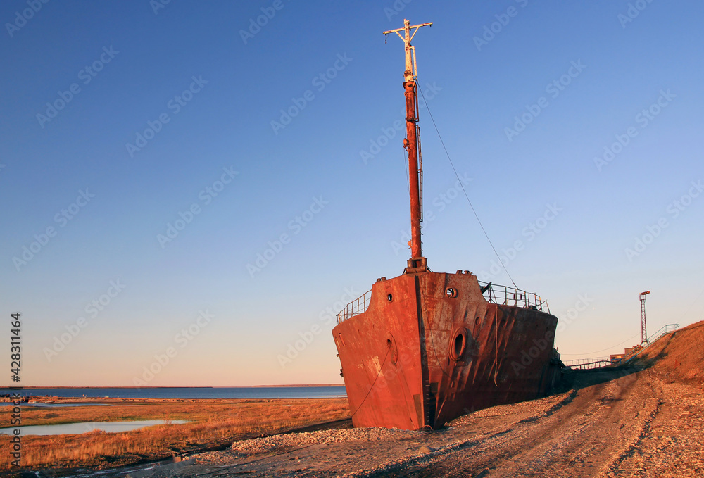 Old rusty ship. Northern river Khatanga. Siberia. Krasnoyarsk region.