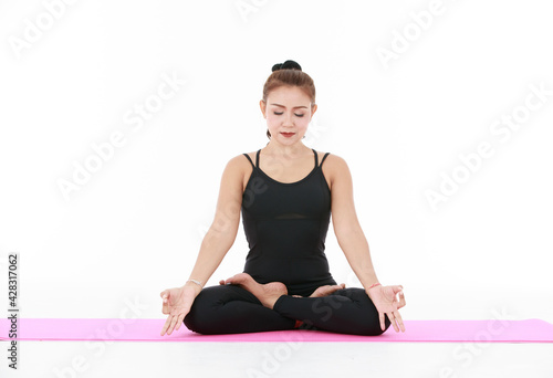 Asian woman meditating in Lotus pose