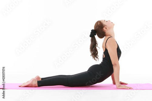 Fototapeta Naklejka Na Ścianę i Meble -  Asian professinal female teacher showing and demonstrate exercise and stretching body with yoga pracetice. Concept for health and balance life